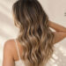JC BALAYAGE SAN ANTONIO colorist hand painting balayage highlights on client hair during consultation